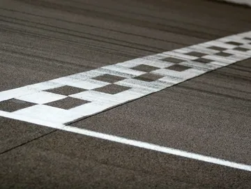 A white and black checkered line on the ground